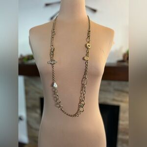 WHBM necklace with mixed metal chains, a faux pearl and charms.